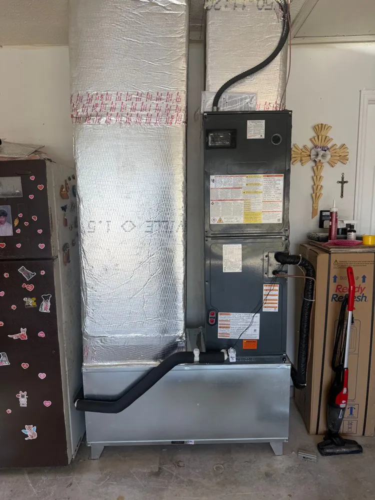 Finished indoor air handler installation with wrapped ductwork